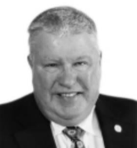 A person in a suit

Description automatically generated with low confidence