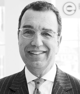 A person in a suit and tie

Description automatically generated