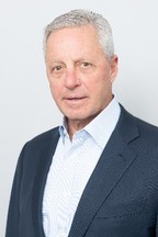 A person in a suit

Description automatically generated with low confidence