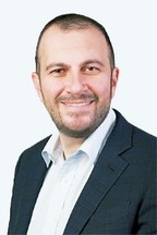 A person in a suit and tie

Description automatically generated with medium confidence