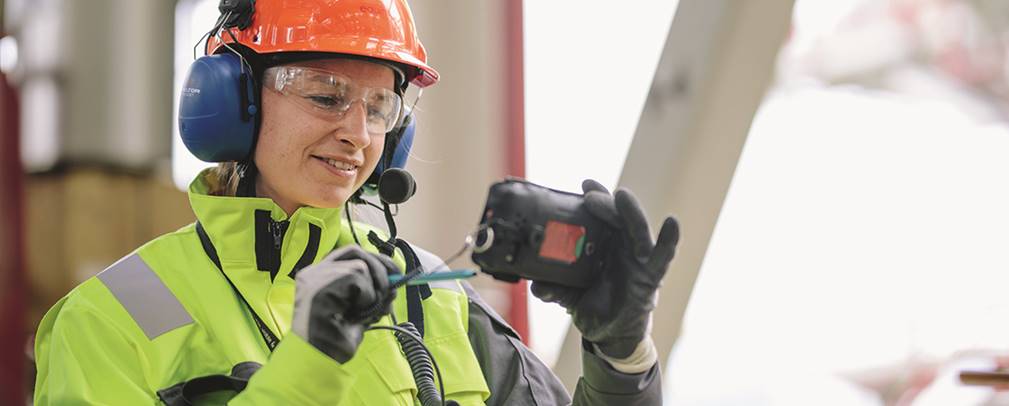 A picture containing wearing, hat, jacket, yellow
Description automatically generated