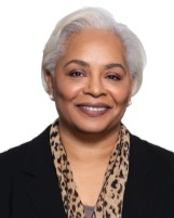 A person smiling for the camera

Description automatically generated with low confidence