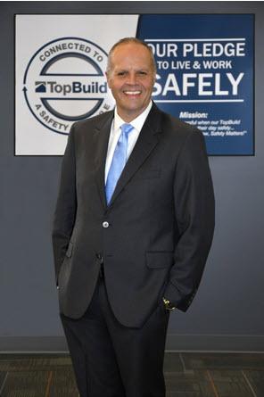 A person in a suit smiling

Description automatically generated with low confidence