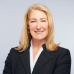 A picture containing person, clothing, person, suit  Description automatically generated