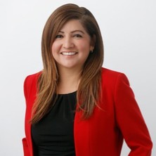 A person in a red shirt  Description automatically generated with low confidence