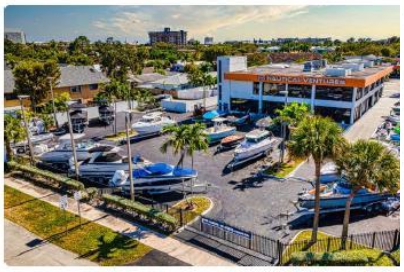 A parking lot with boats and trees

AI-generated content may be incorrect.